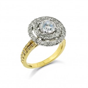 A round diamond with two rows of G VS diamonds mounted in 18K gold with a split shank