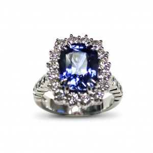 A 4.52 carat cushion cut Sapphire mounted with G VS diamonds in 18K white gold