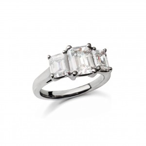 An Emerald cut 3 stone ring mounted in Platinum weighing 1.95 carats G colour VS clarity 
