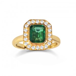 An Emerald cut Emerald engagement ring mounted with diamonds in 18k yellow gold