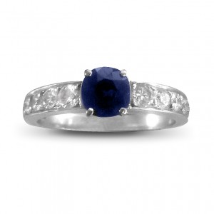 A round Sapphire weighing 1.20 carats set with diamonds mounted in 18K white gold