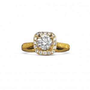 A round brilliant diamond set in an antique style engagement ring